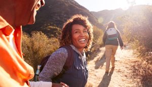 Healthy active adults hiking outdoors supporting immune health after 40